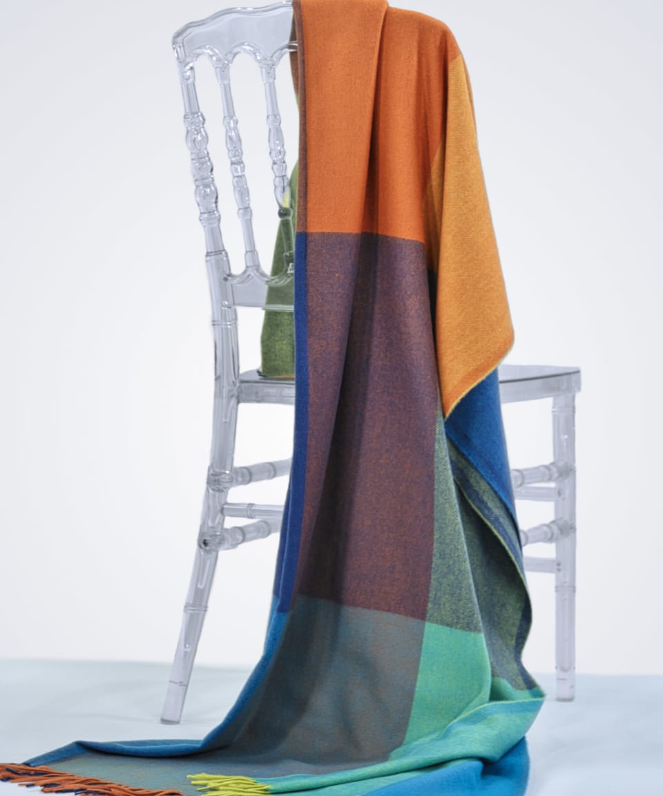 check-coloured cashmere blanket draped over a chair