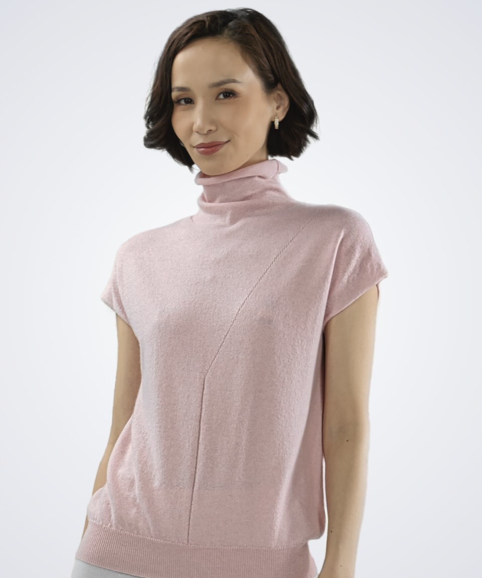 Women's pink high neck woven cashmere vest, front view showing turtleneck design and textural knit detailing