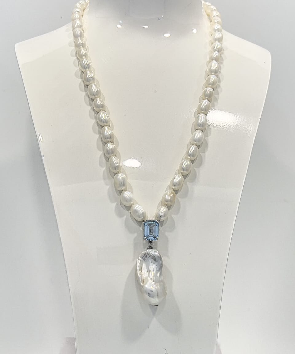 Signature baroque pearl pendant necklace with a square-cut topaz and delicate chain of smaller baroque pearls