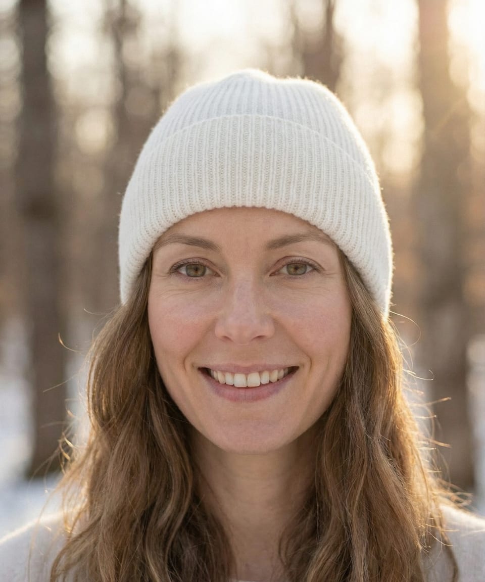 Woman outdoors wearing white ribbed cashmere hat, front view