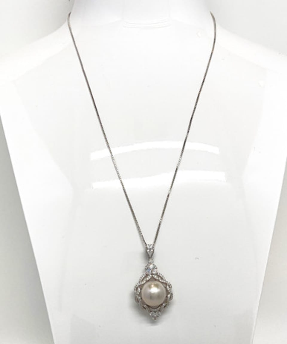 Unur signature round pendant necklace with freshwater pearl and crystal detail