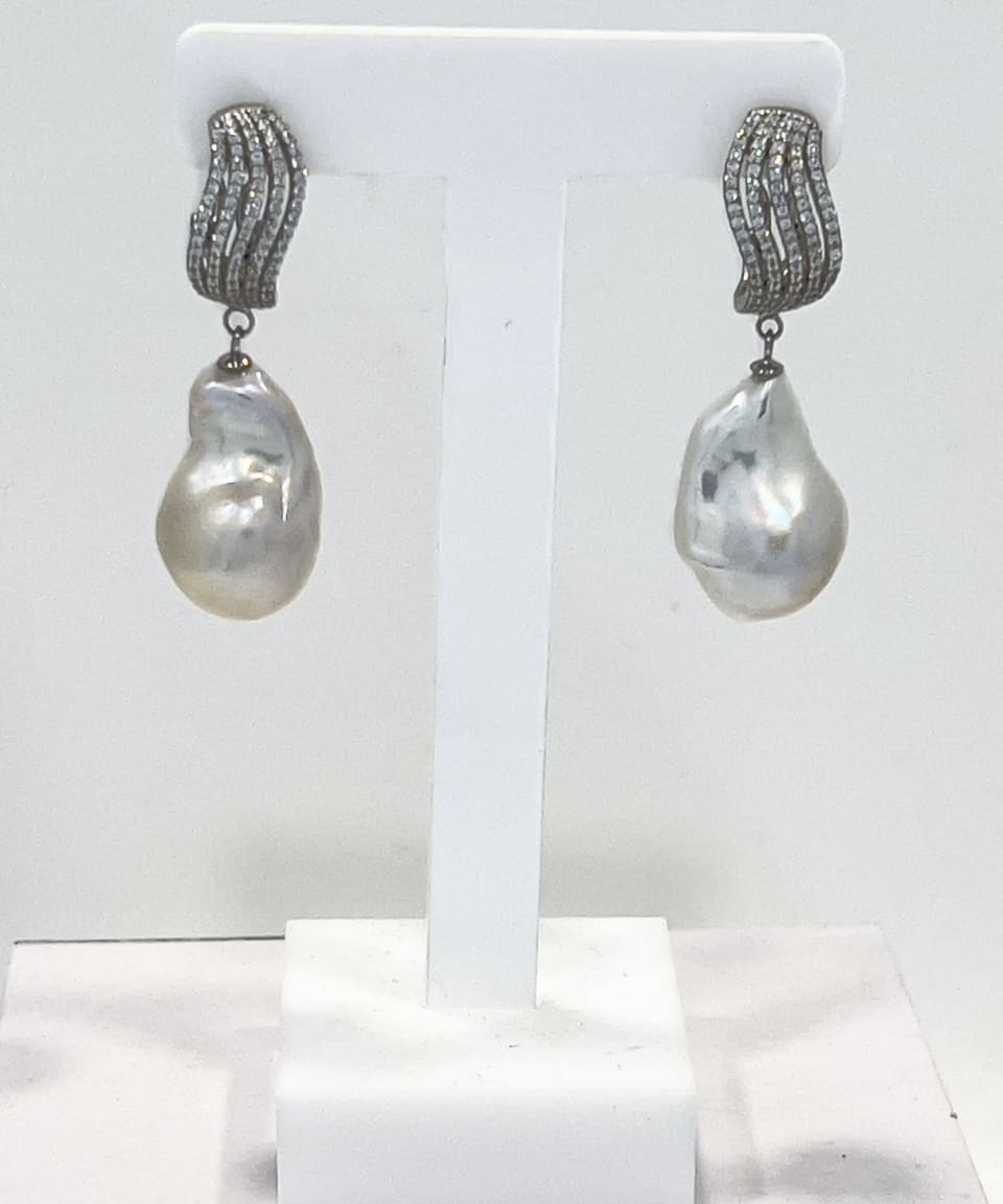 Signature baroque pearl drop earrings with a silver crystal wave