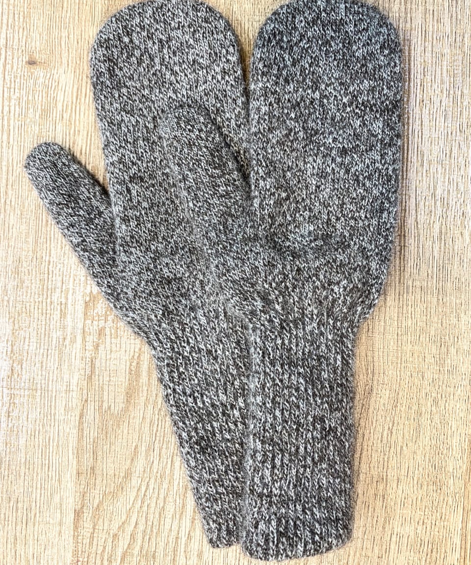 Mottled brown yak wool mitten gloves on neutral background, flat view