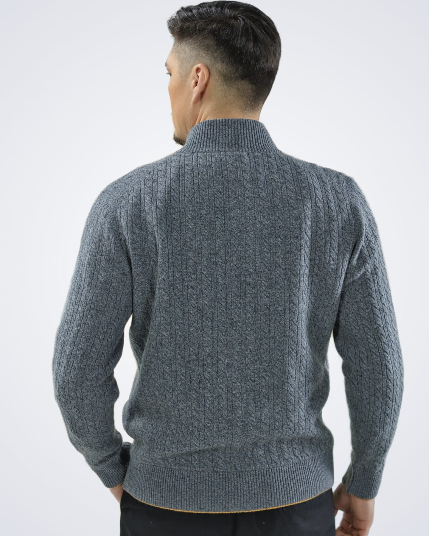 Man wearing a luxury grey cashmere cable knit cardigan, back view