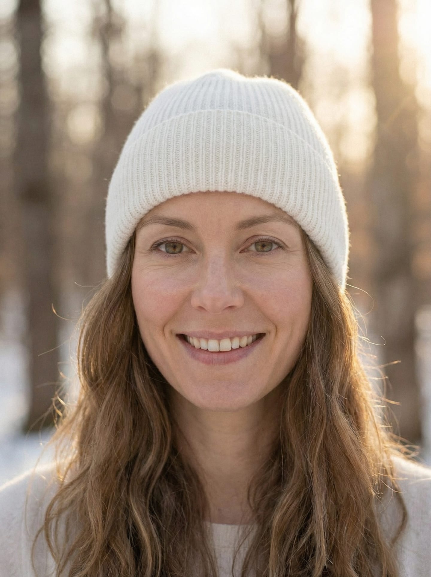 Woman outdoors wearing white ribbed cashmere hat, front view