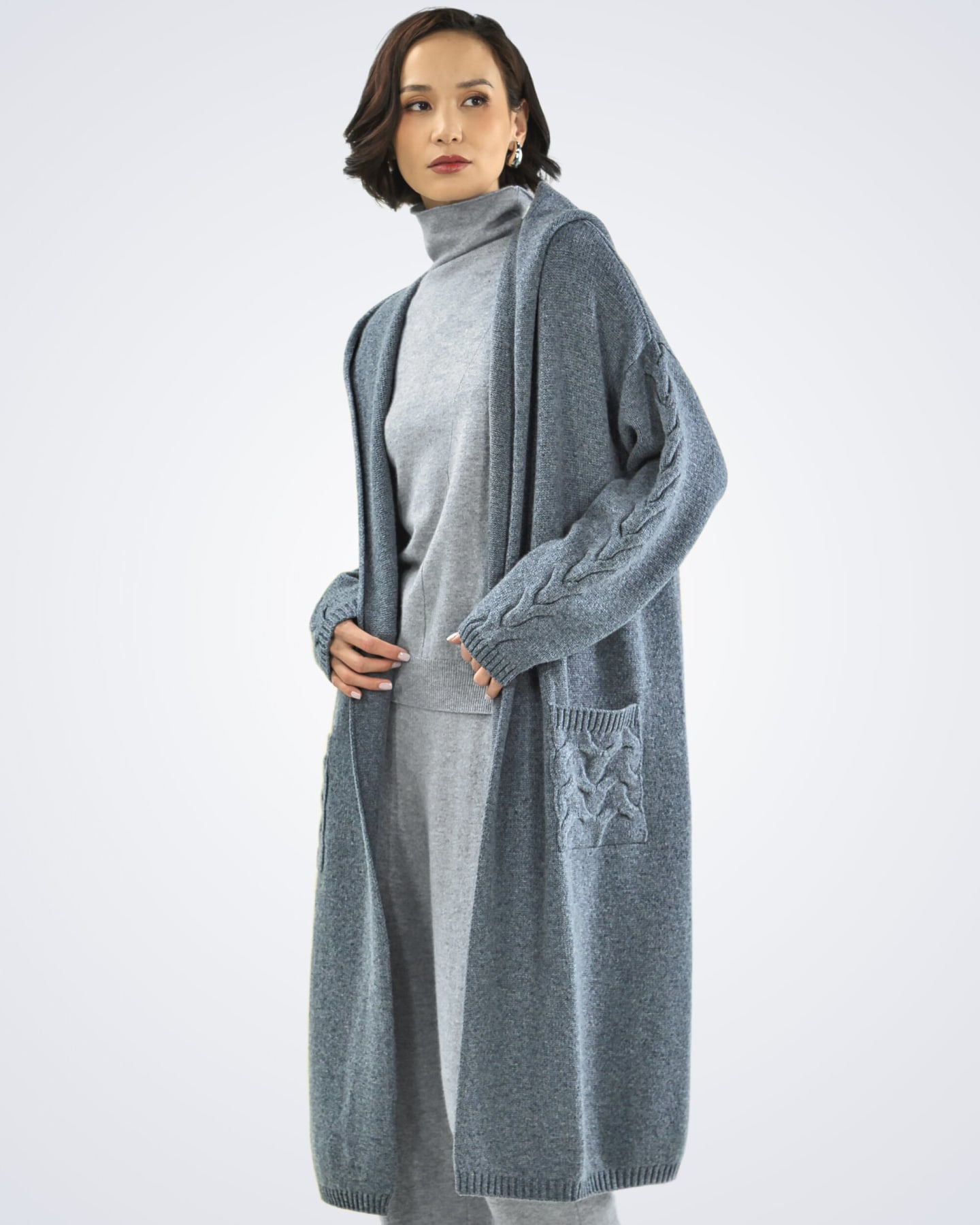 Front view of women's dark grey cashmere cable knit cardigan pockets – Unur