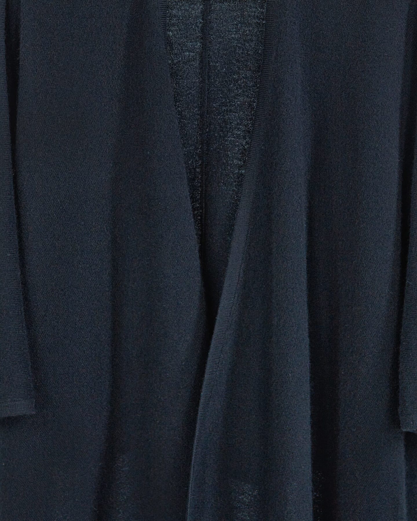 Close-up of soft cashmere cape in black