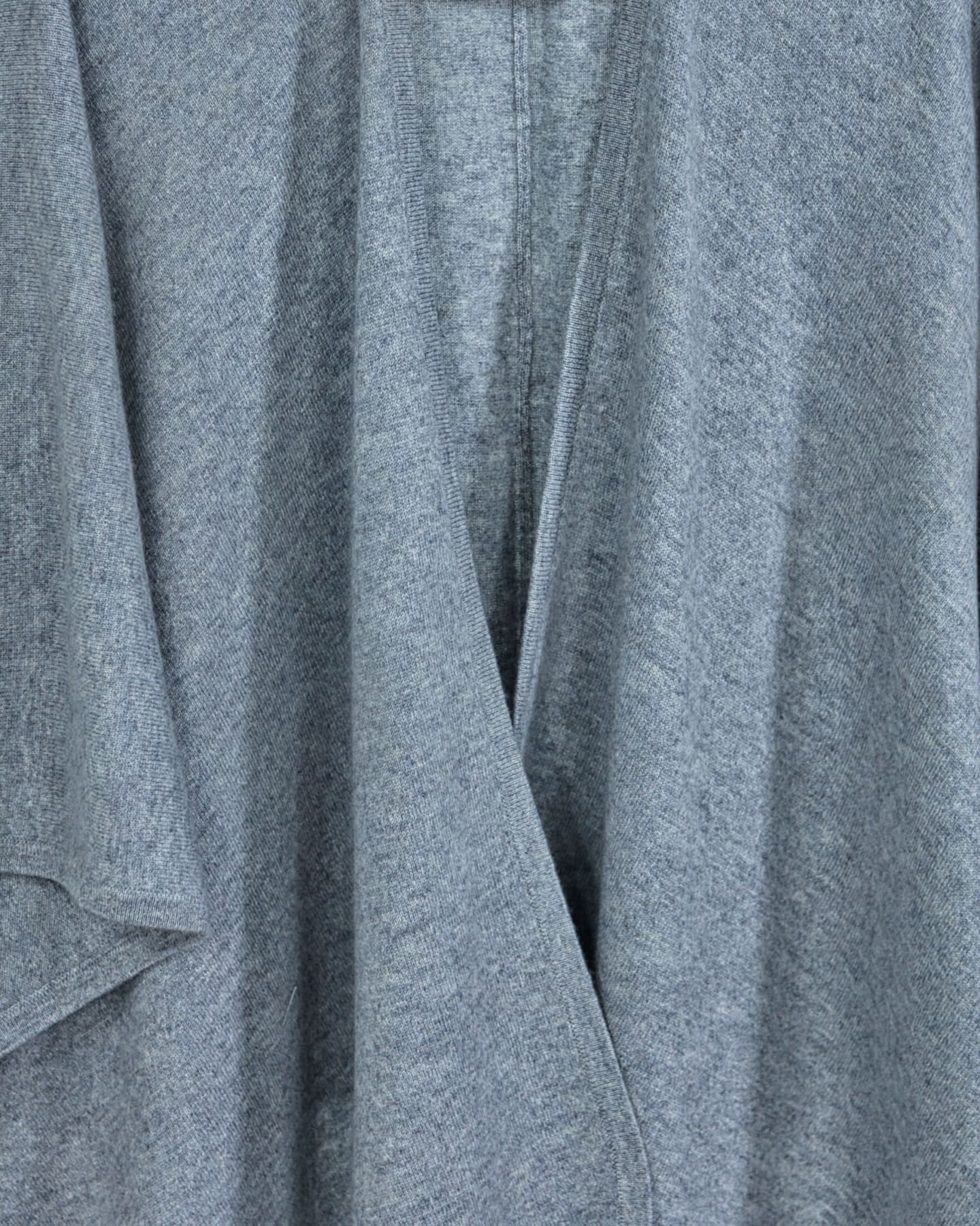 Close-up of soft cashmere cape in grey