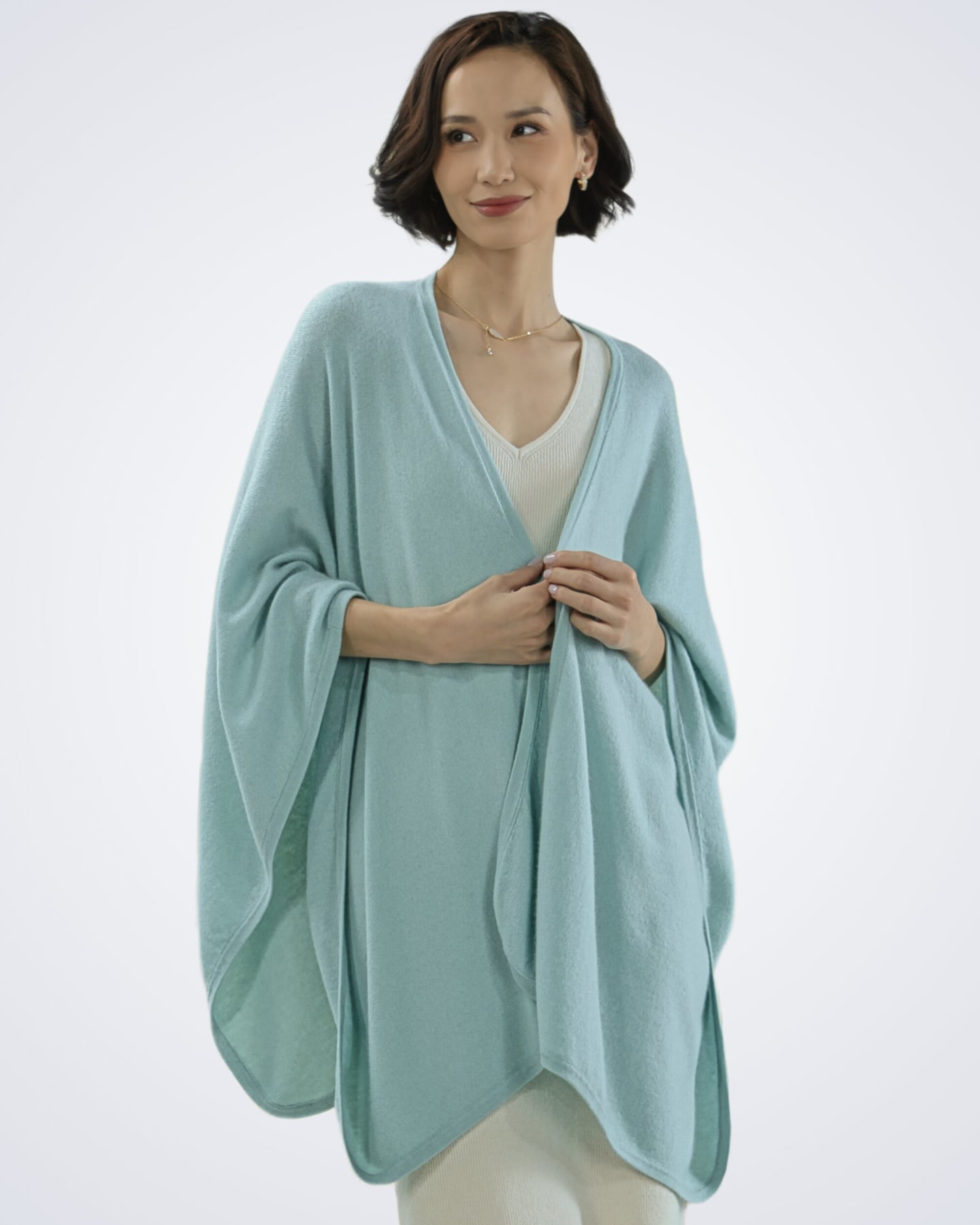 Front view of women's mint green cashmere cape – Unur