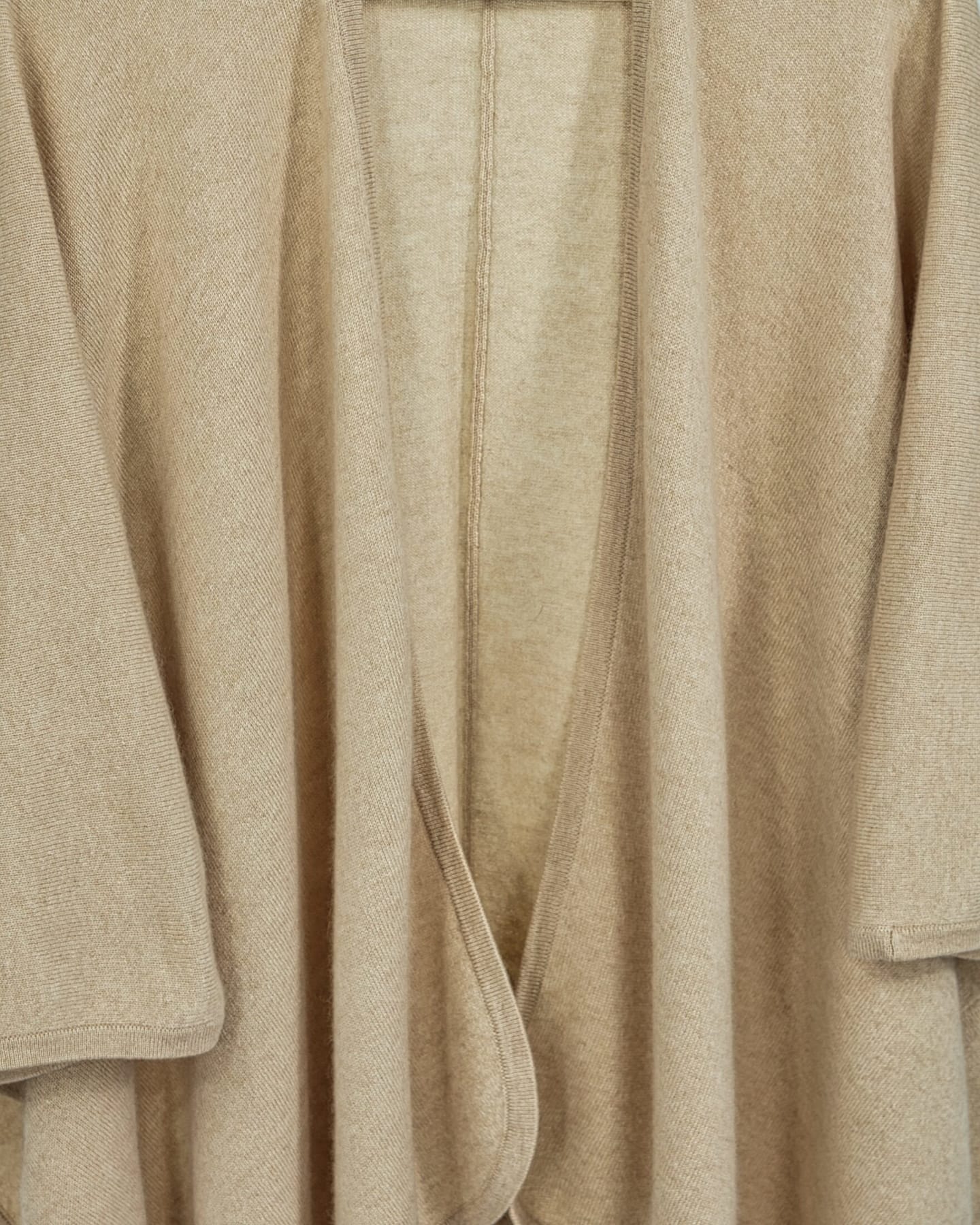 Close-up of soft cashmere cape in natural beige
