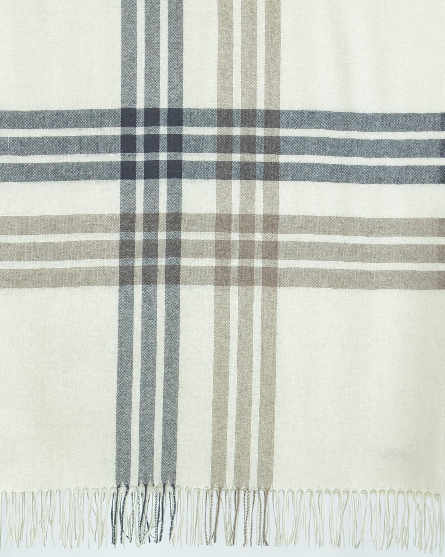 Close up of a natural white plaid cashmere wrap shawl