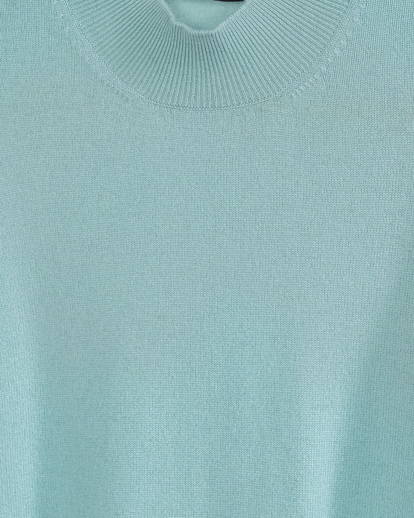 Close-up of soft cashmere t-shirt in mint green