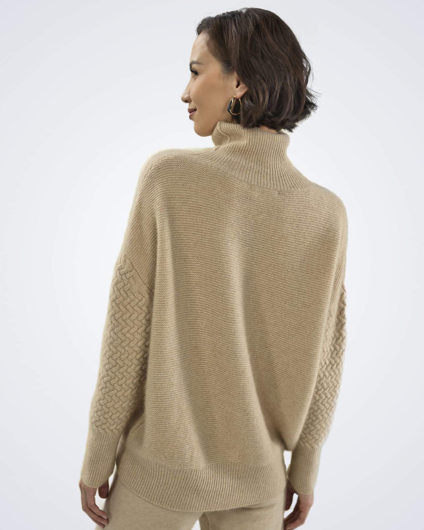 Back view of women's natural beige cashmere cable knit cardigan – Unur
