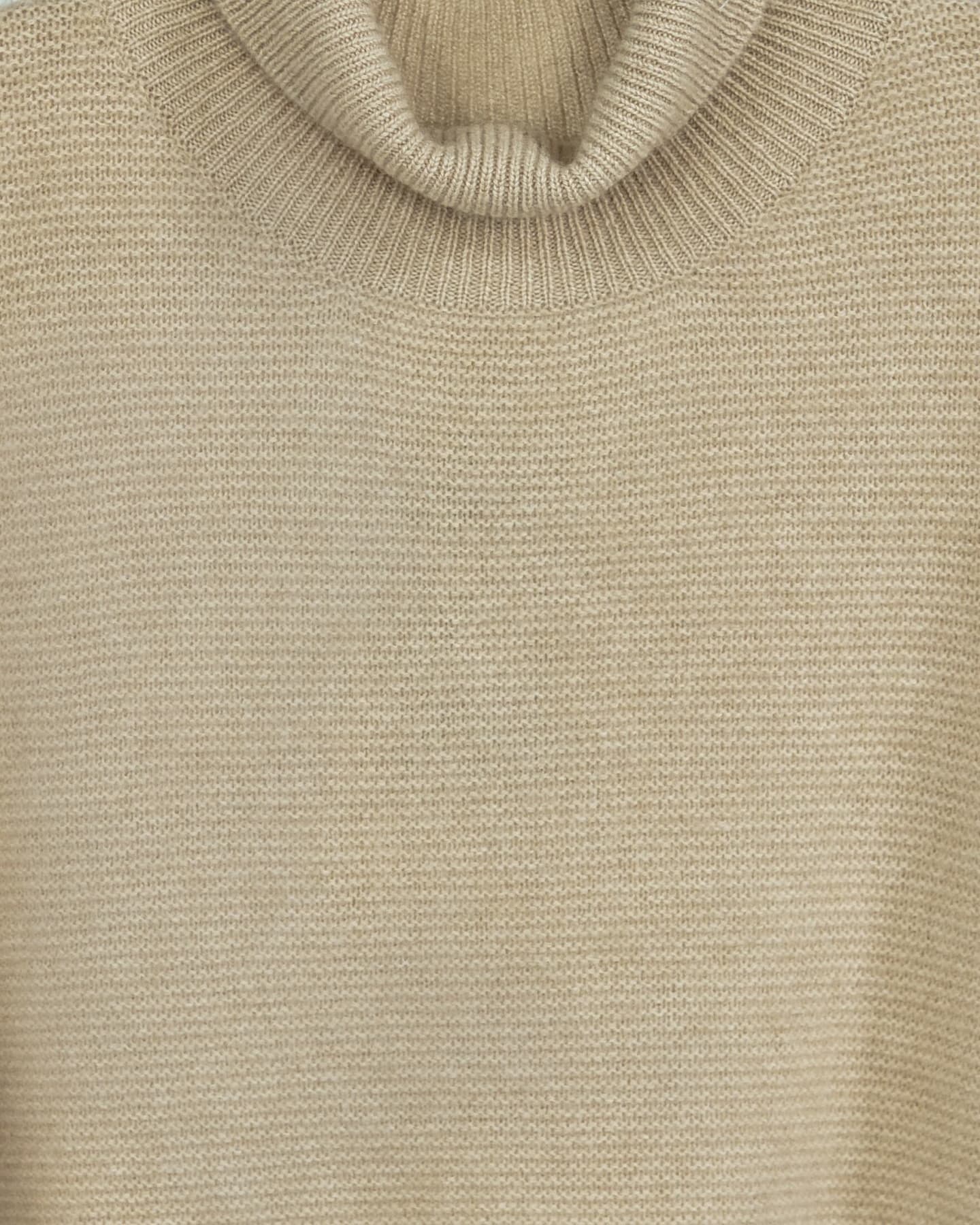 Close-up of soft cashmere jumper in natural beige