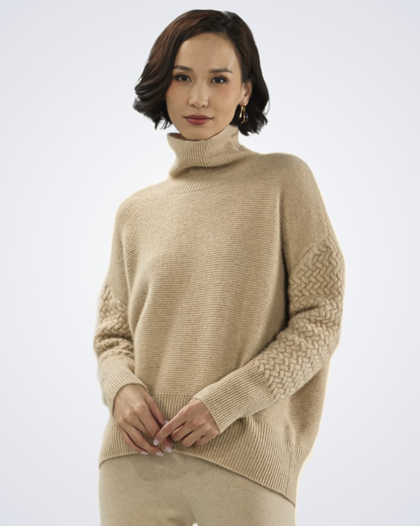 Front view of women's natural beige cashmere cable knit cardigan – Unur