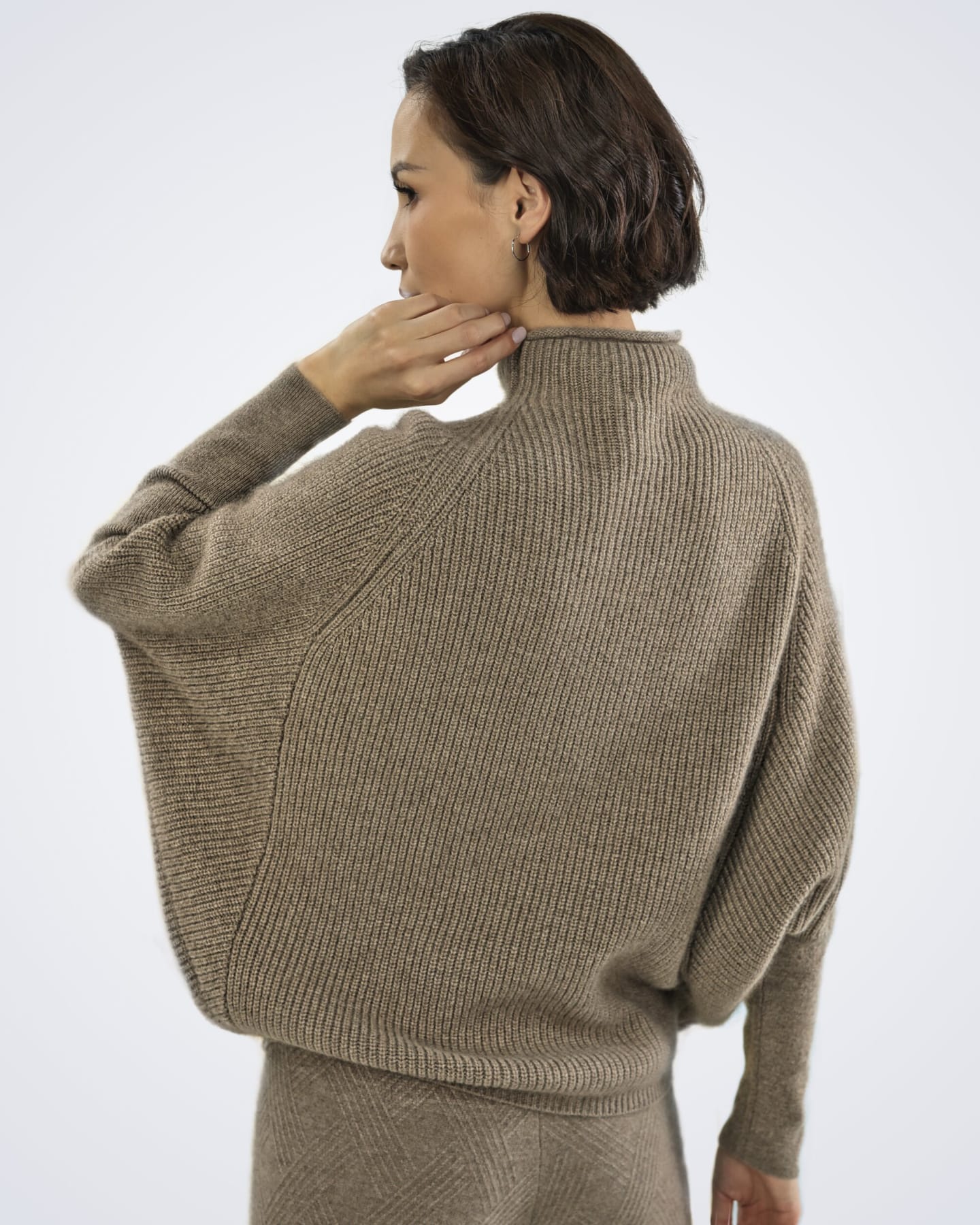 Back view of oversized cashmere jumper in natural brown showing relaxed fit