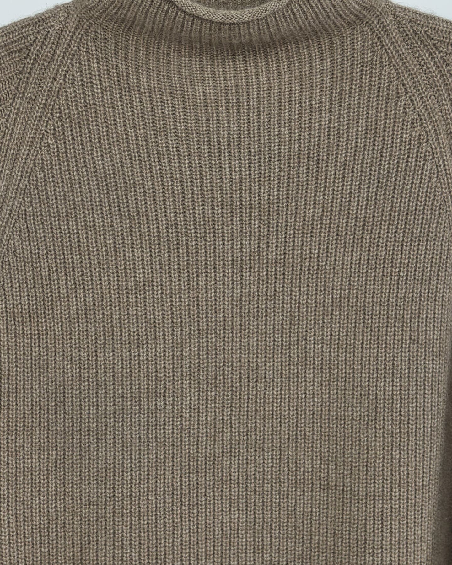 Close-up detail of ribbed cashmere knit texture in natural brown