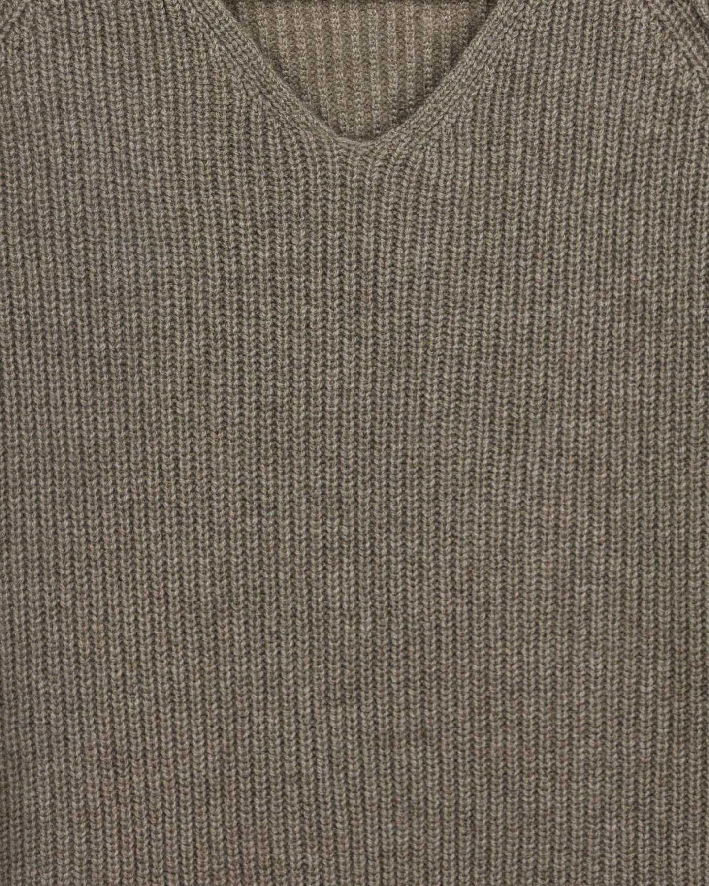 Close-up of soft cashmere ribbed jumper in natural brown
