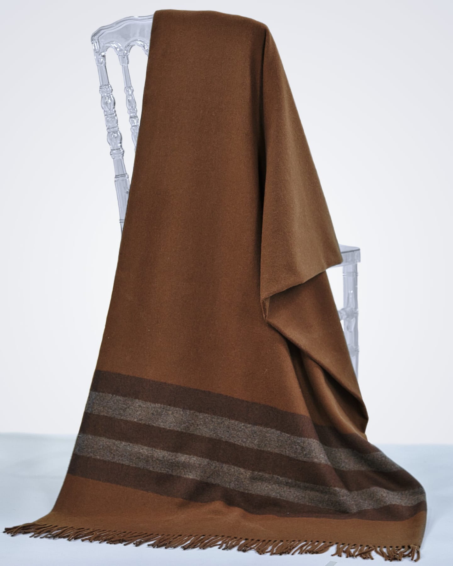 brown cashmere blanket draped over a chair