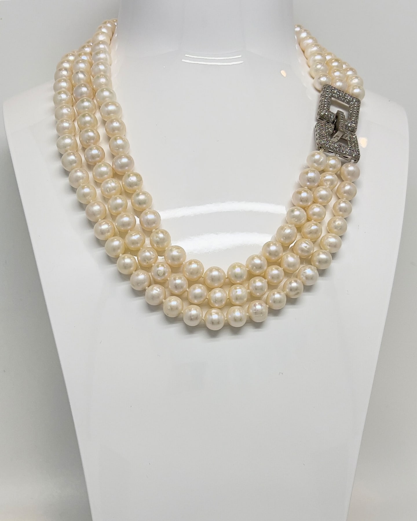 Classic layered white pearl necklace with a square crystal clasp