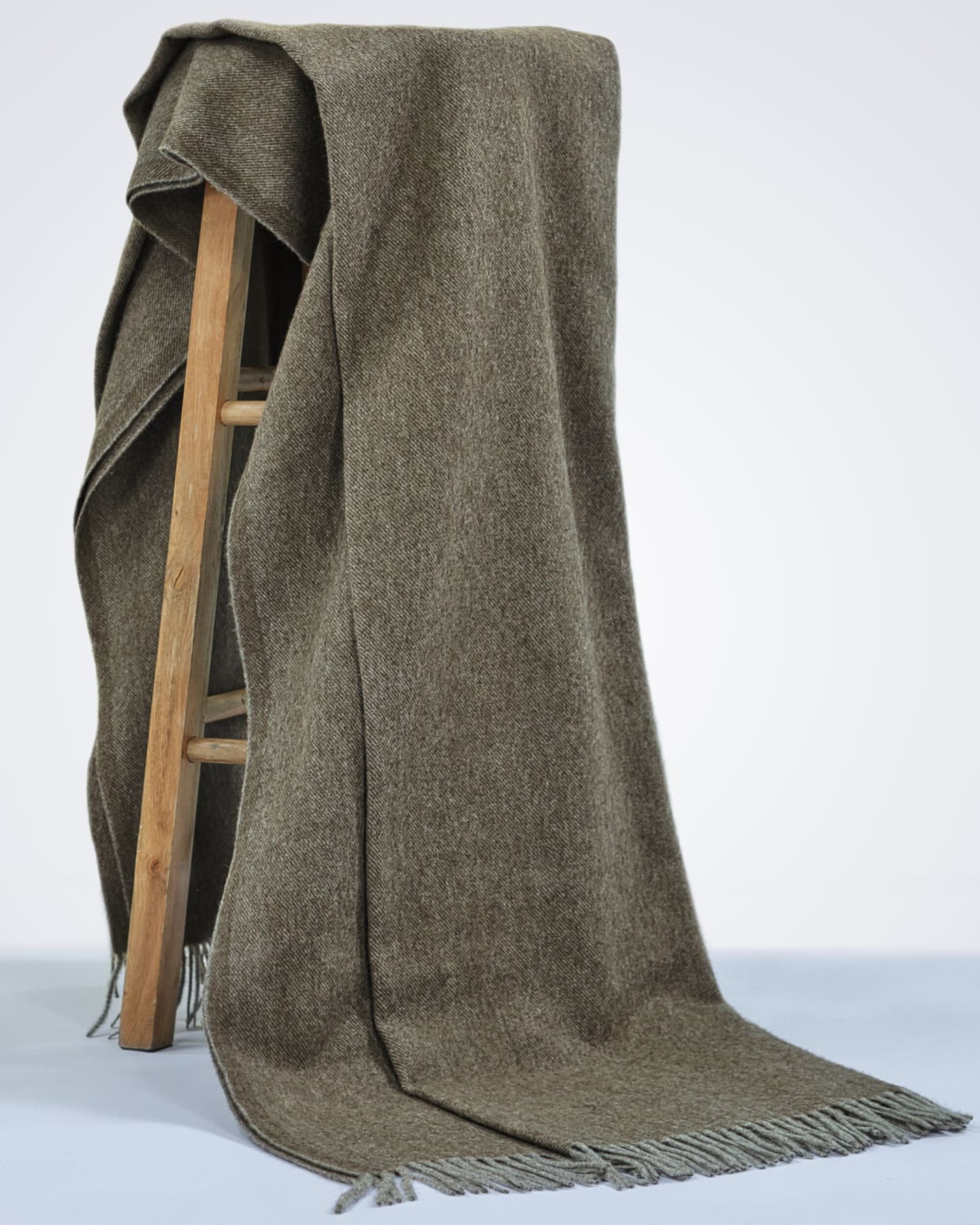 natural brown yak wool blanket draped over a chair