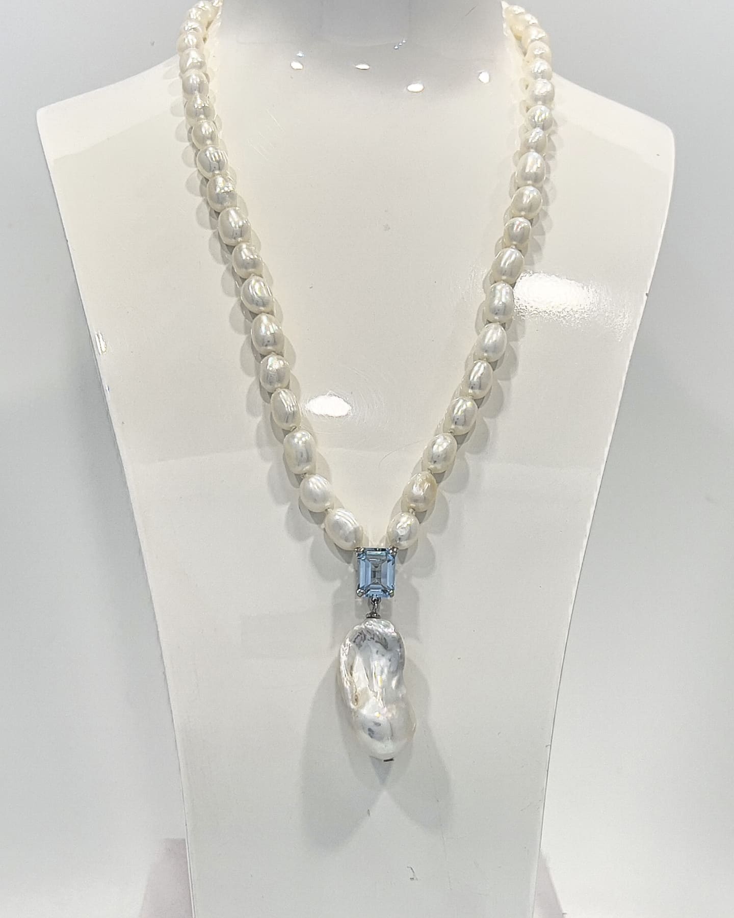 Signature baroque pearl pendant necklace with a square-cut topaz and delicate chain of smaller baroque pearls