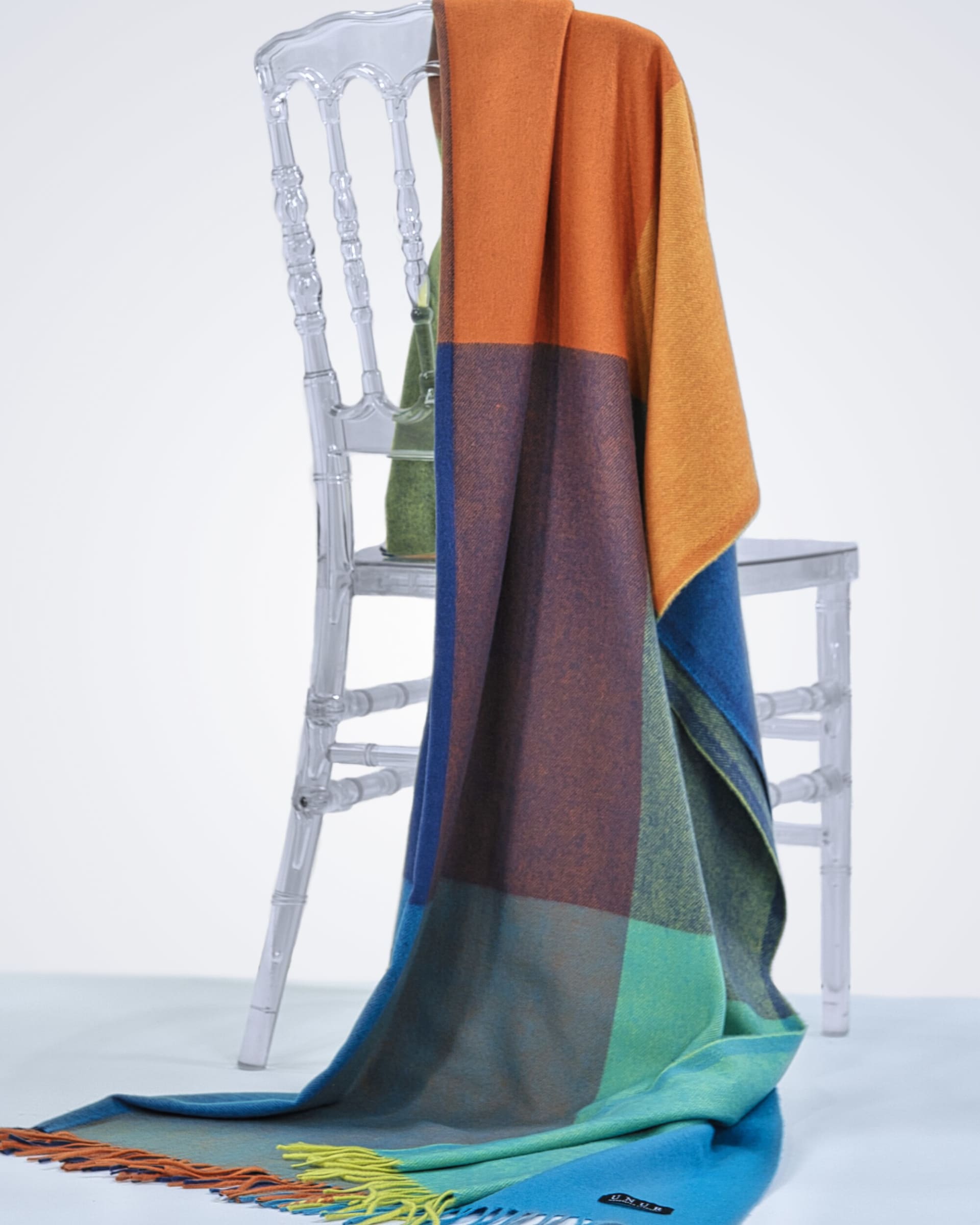 check-coloured cashmere blanket draped over a chair