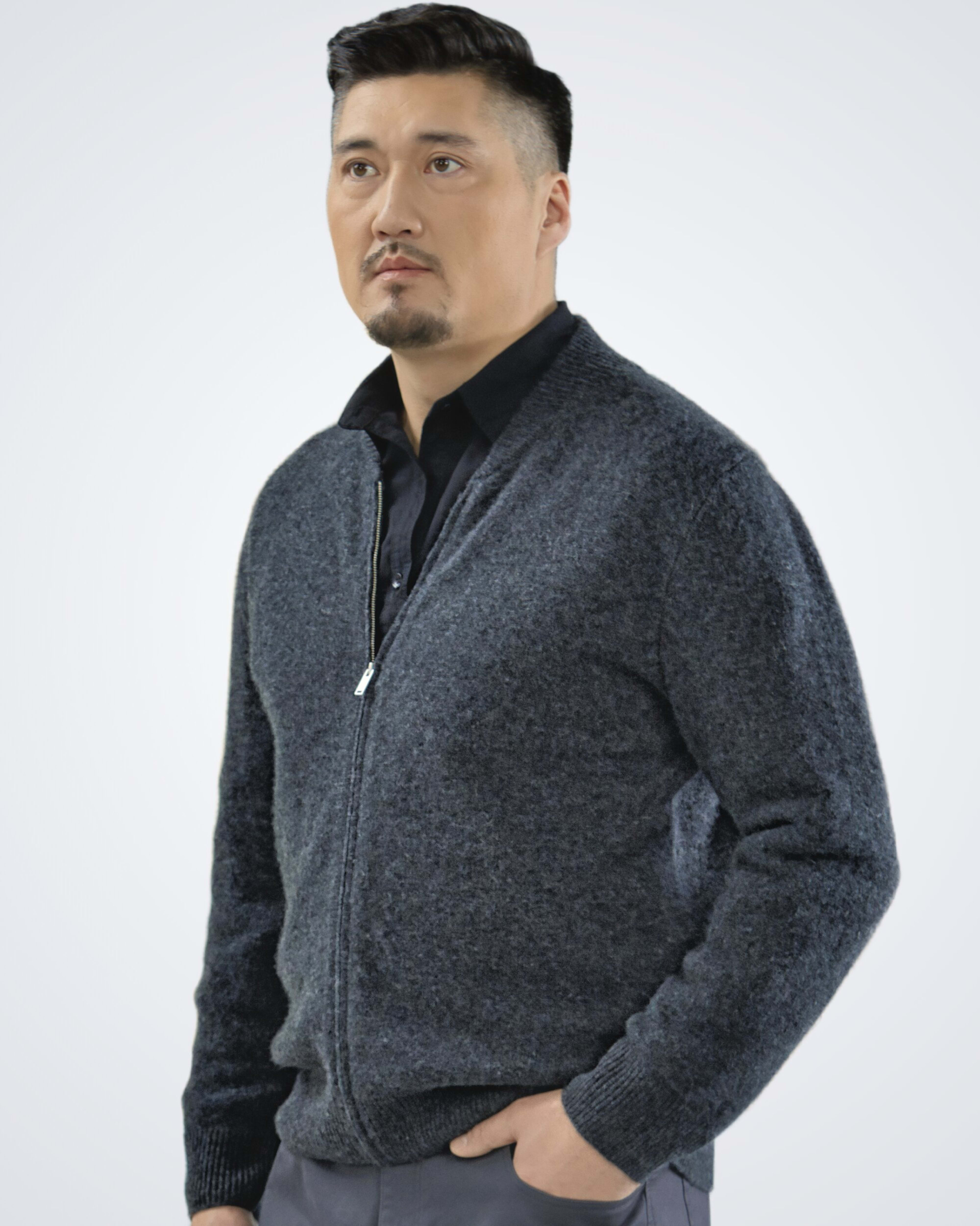 Man wearing a dark grey classic cashmere cardigan with ribbed details, front view