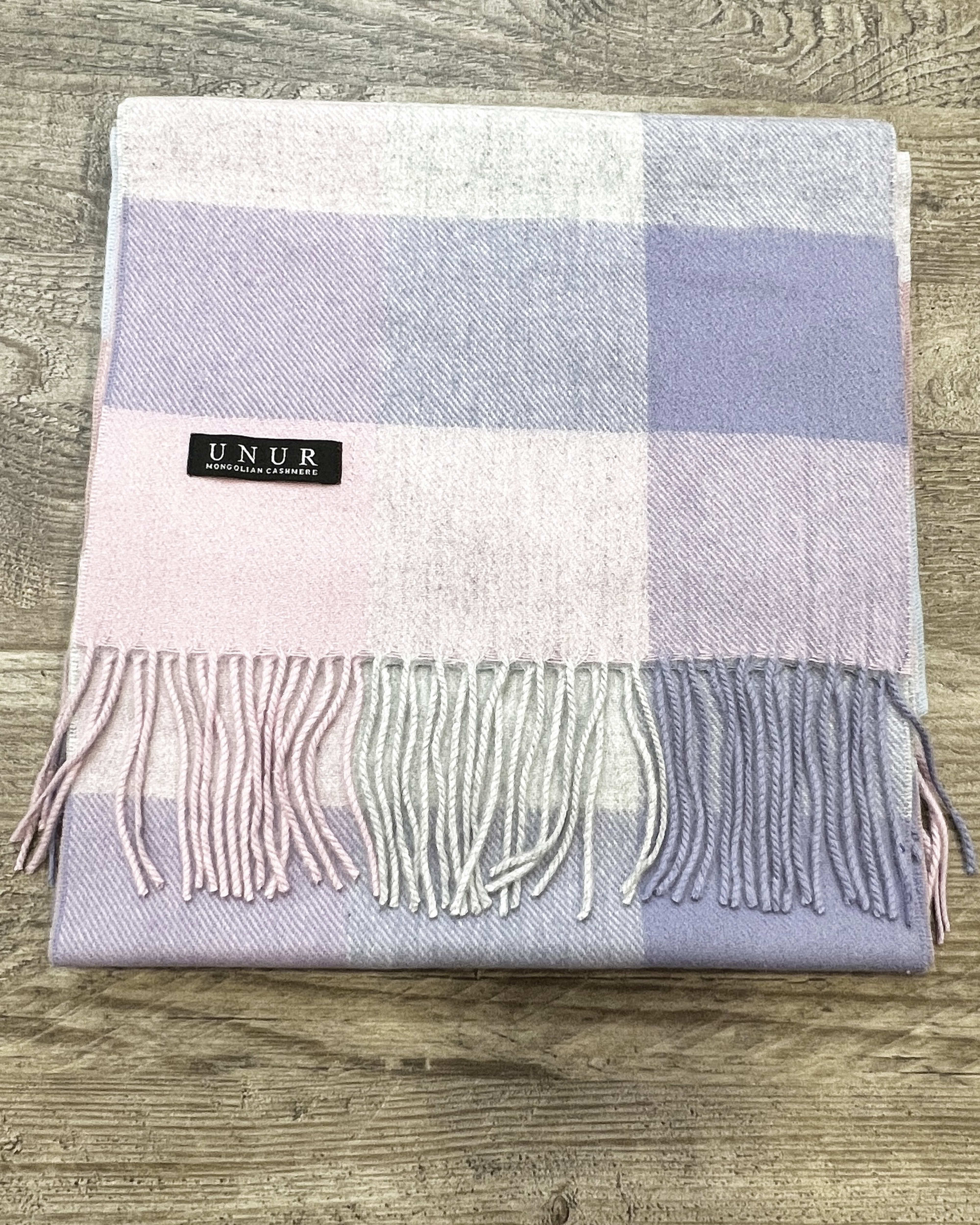 Lay-flat close up of check purple unisex woven cashmere scarf with tassles