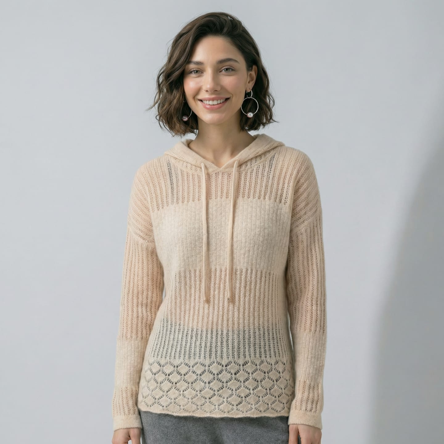 Women's natural beige cashmere hoodie with all-over openwork knit, horizontal ladder stitch across the yoke, diamond mesh body and scalloped pointelle hem, drawstring hood, primary product view