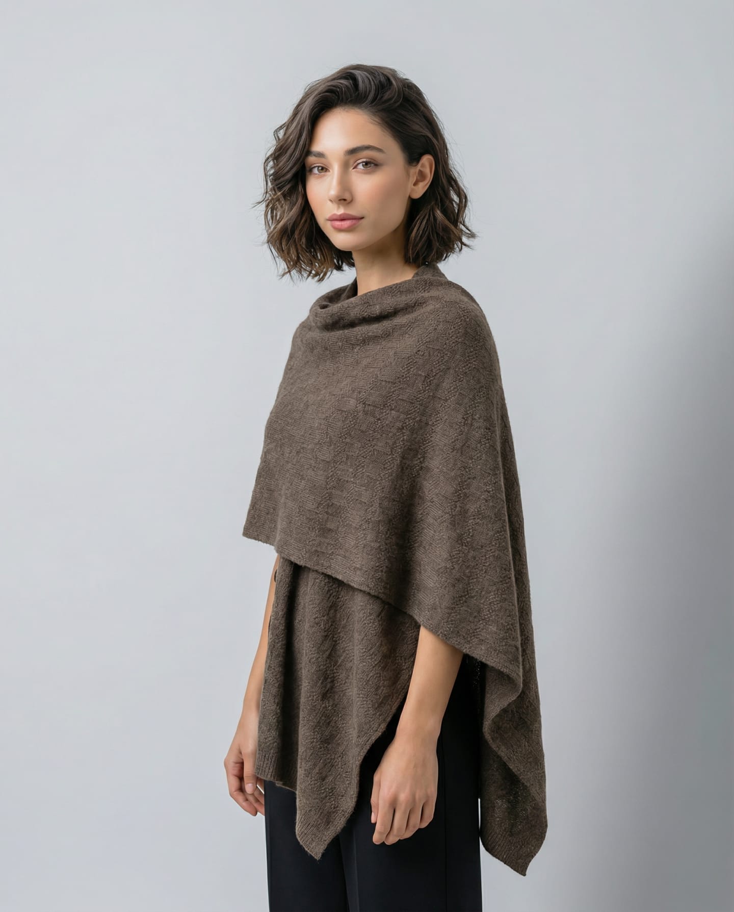 Woman wearing a textured yak wool shawl in brown