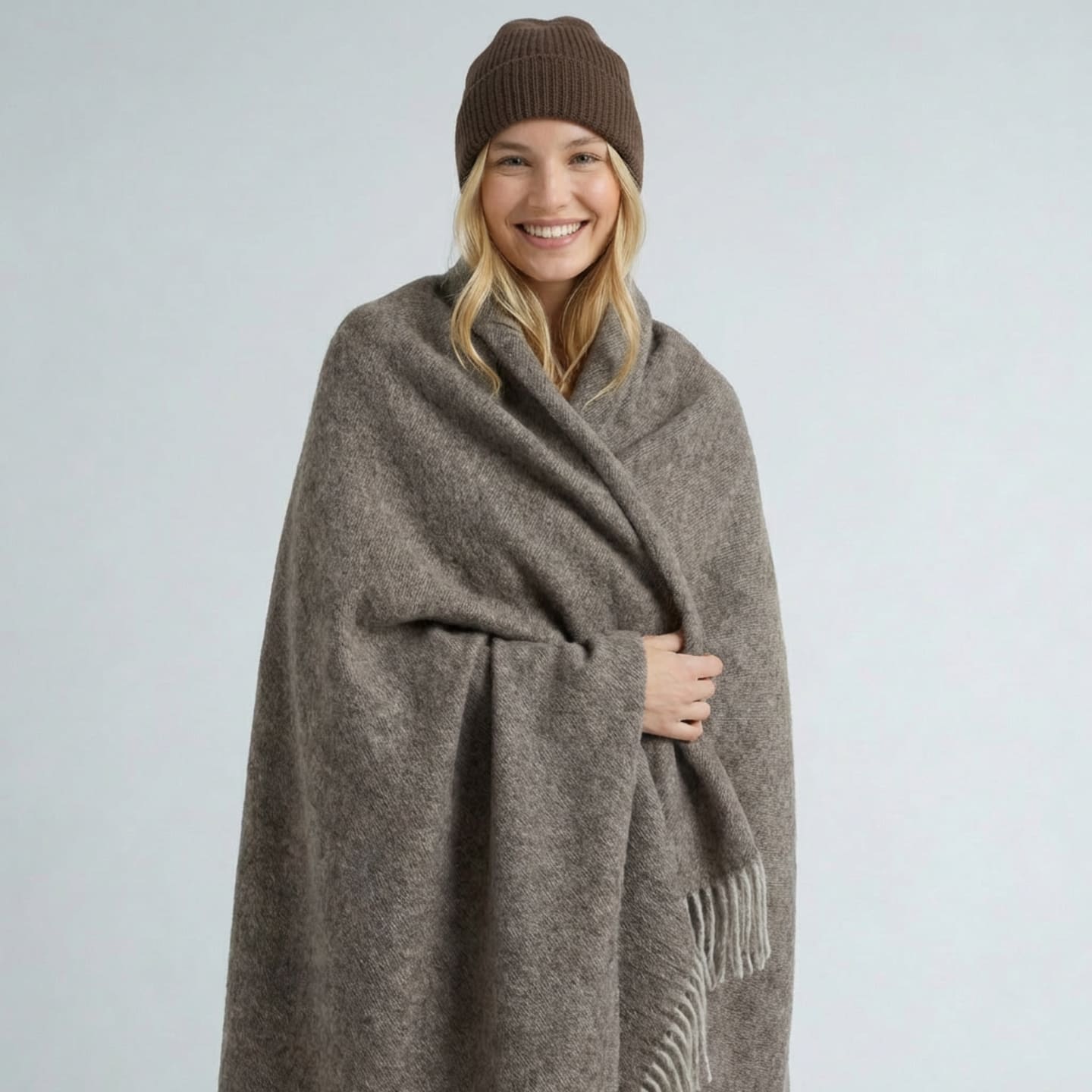 woman wrapped in a natural brown yak wool blanket