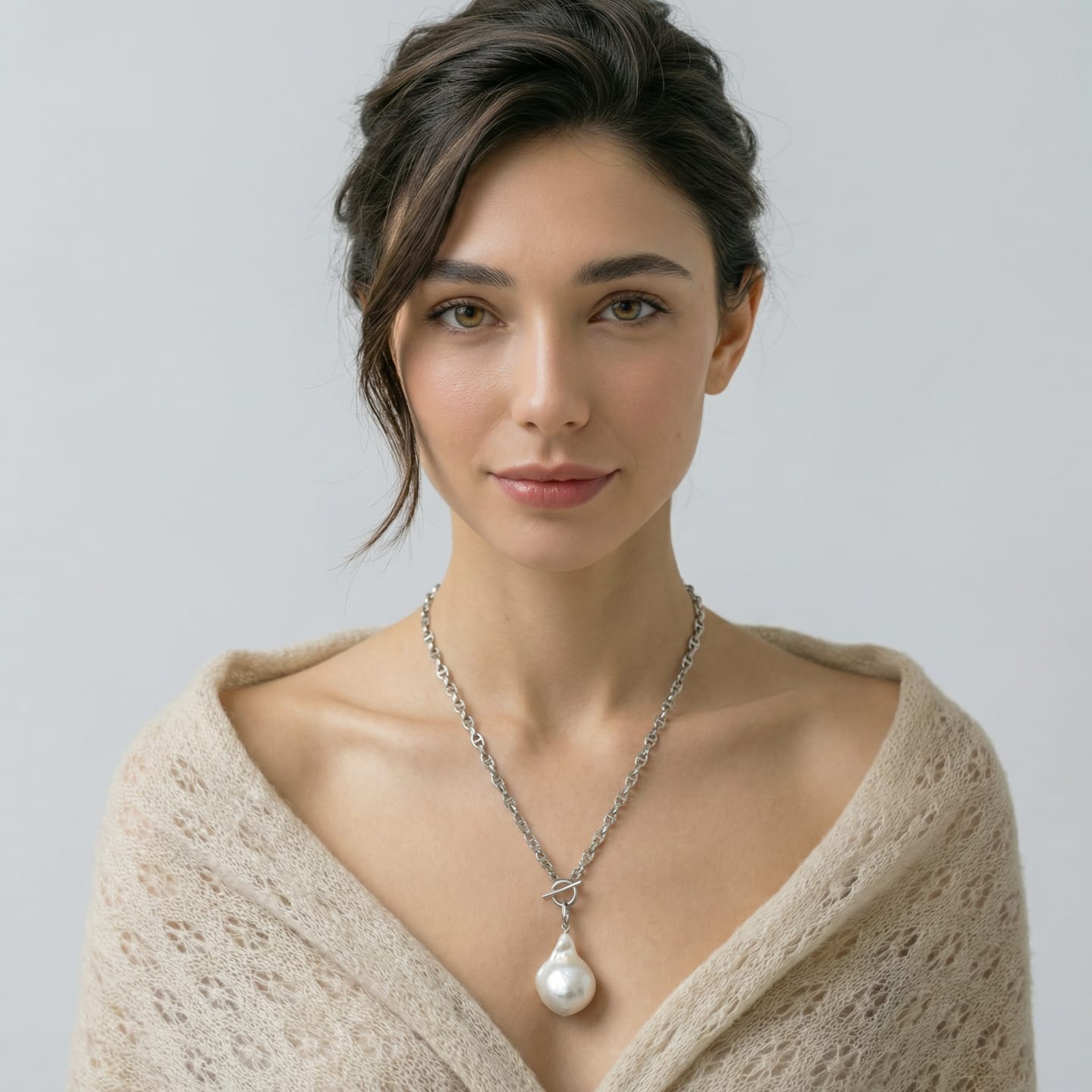 Unur Classic Baroque Pearl Toggle Pendant Necklace displayed on a necklace stand, showing the full silver cable-link chain, the front-facing toggle clasp, and the large baroque freshwater pearl drop suspended from it