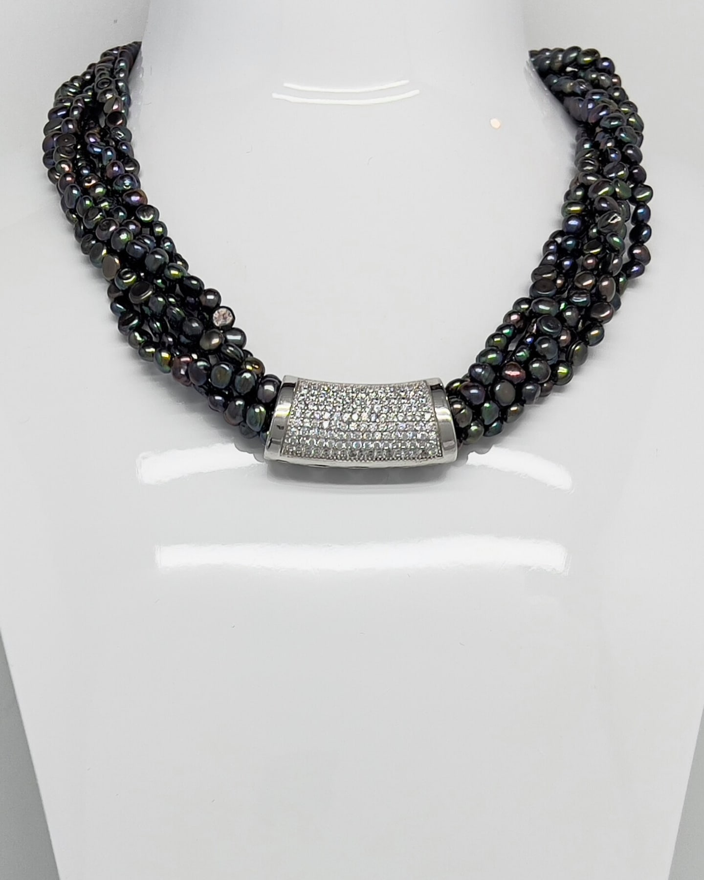 Classic Baroque Statement Necklace on a white bust display, showing the multi-strand dark pearls and pavé crystal silver clasp.