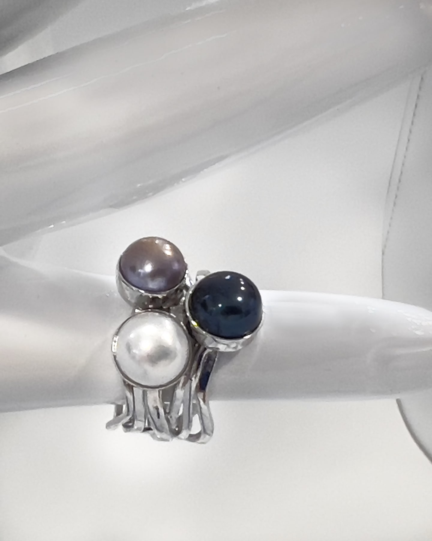 Signature three-colour pearl ring on a layered rhodium-plated sterling silver band