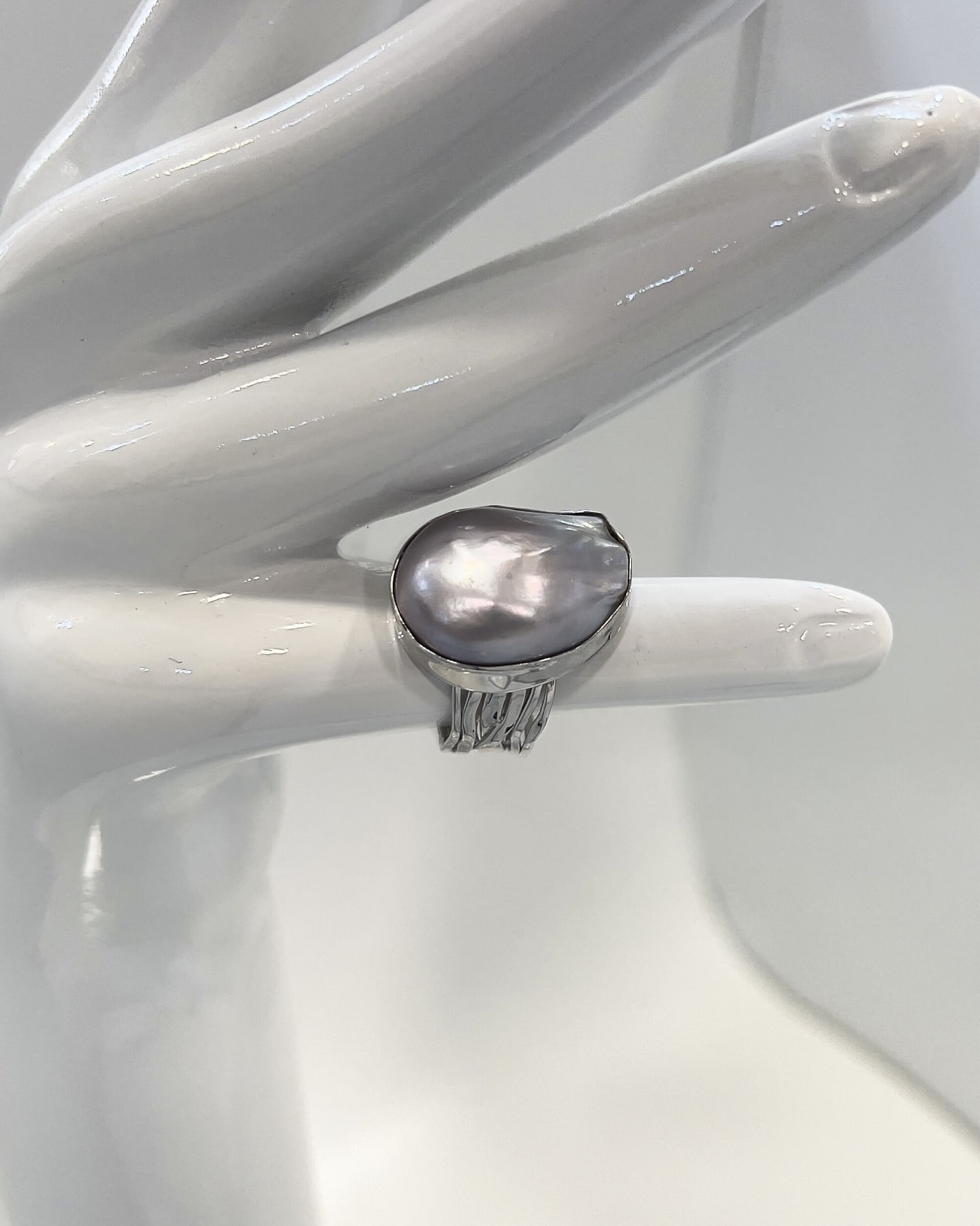 Unur Signature Statement Ring with a large baroque pearl on a layered silver band