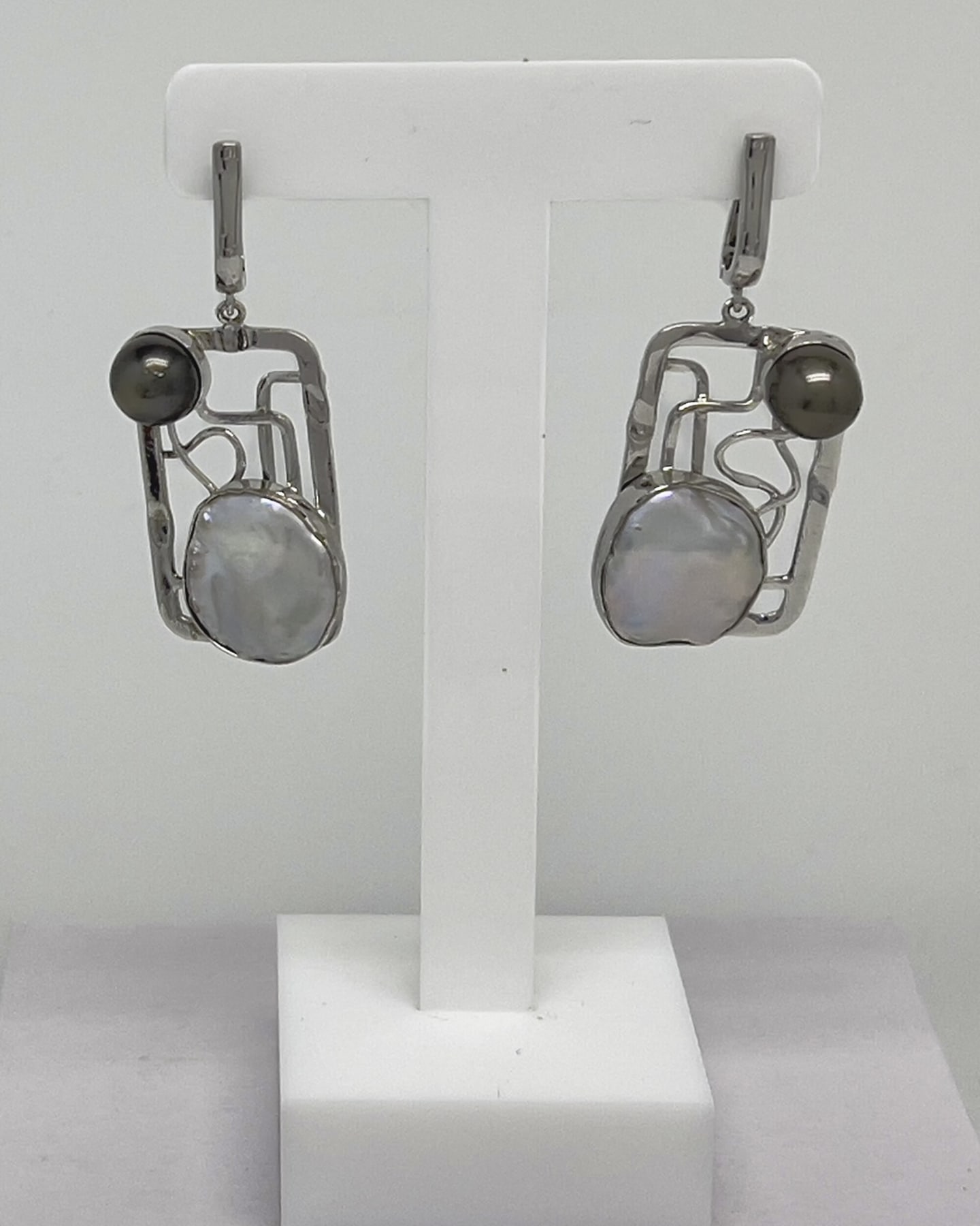 Signature drop earrings with Tahitian and Keshi pearls set in a square silver lattice design