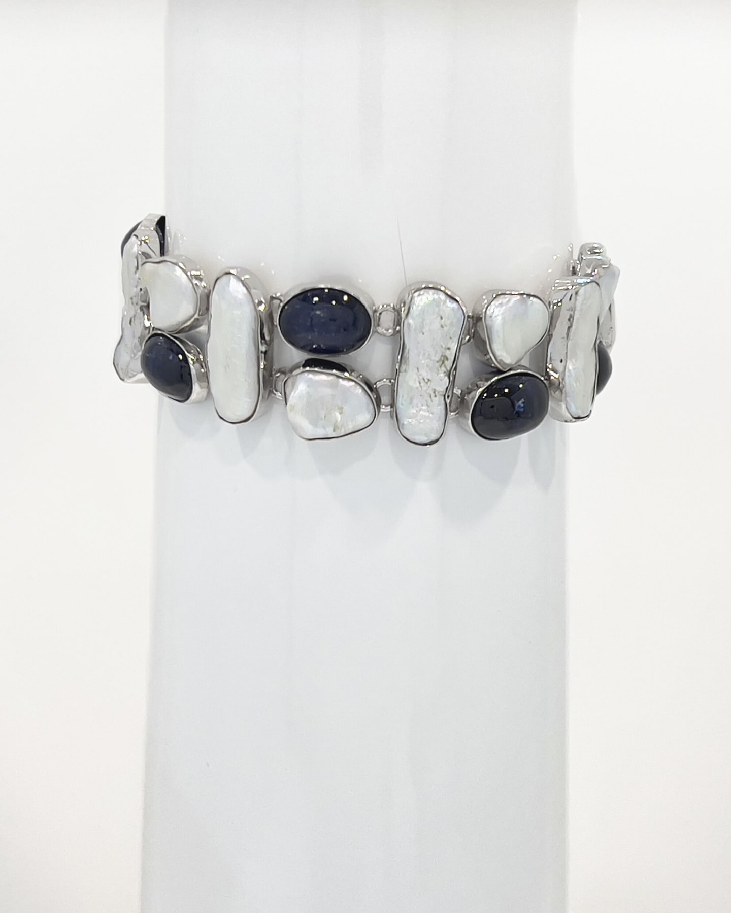Unur Signature Biwa Pearl and Kyanite bracelet, mounted product shot showing the alternating bezel-set Biwa pearls and oval kyanite stones in polished sterling silver