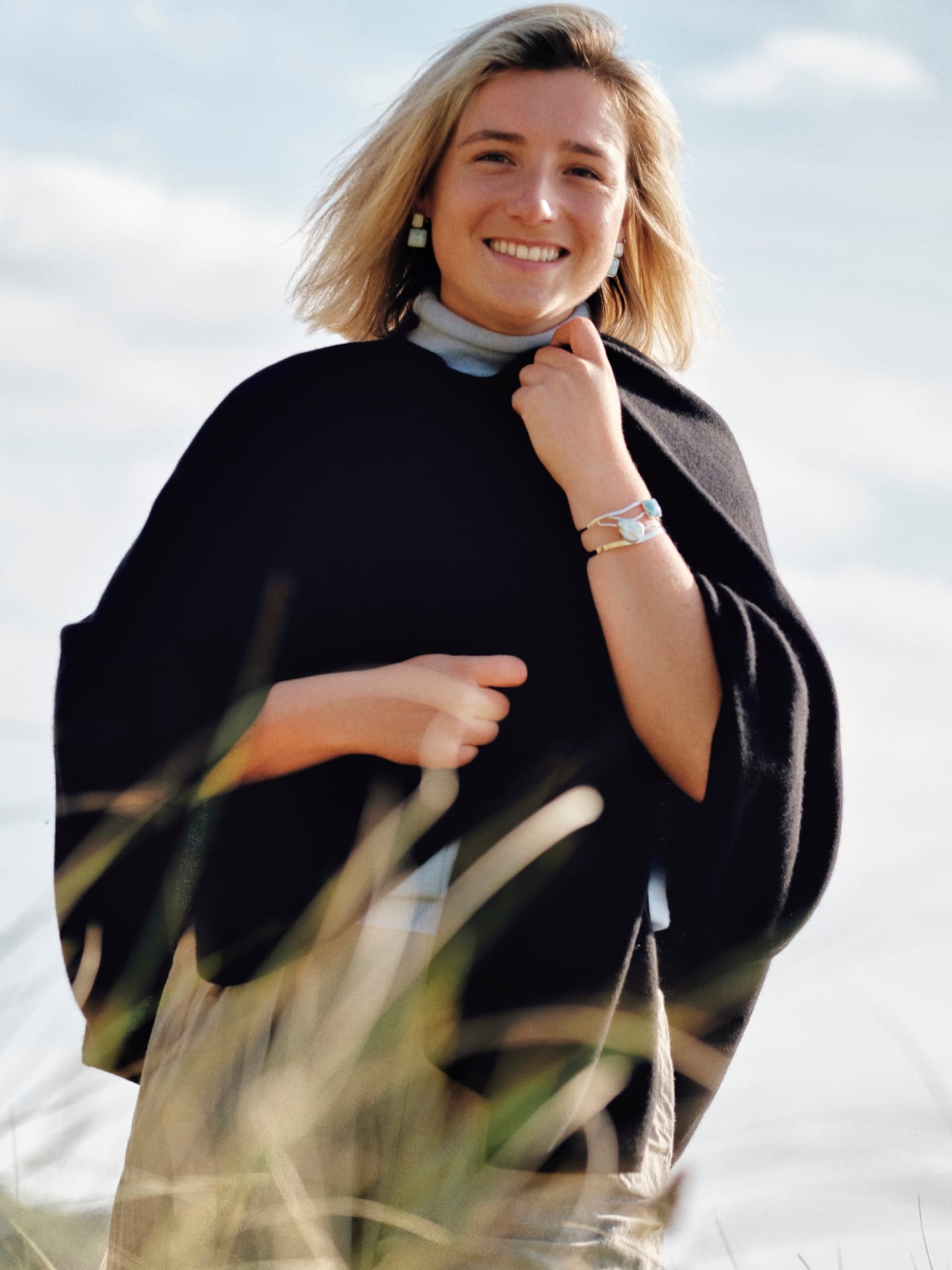 Women's black cashmere cape on model