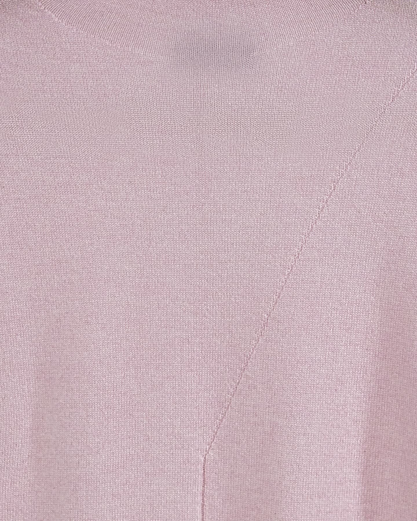 Close-up of the pink cashmere vest showing fine plain knit and the diagonal front panel seam – Unur