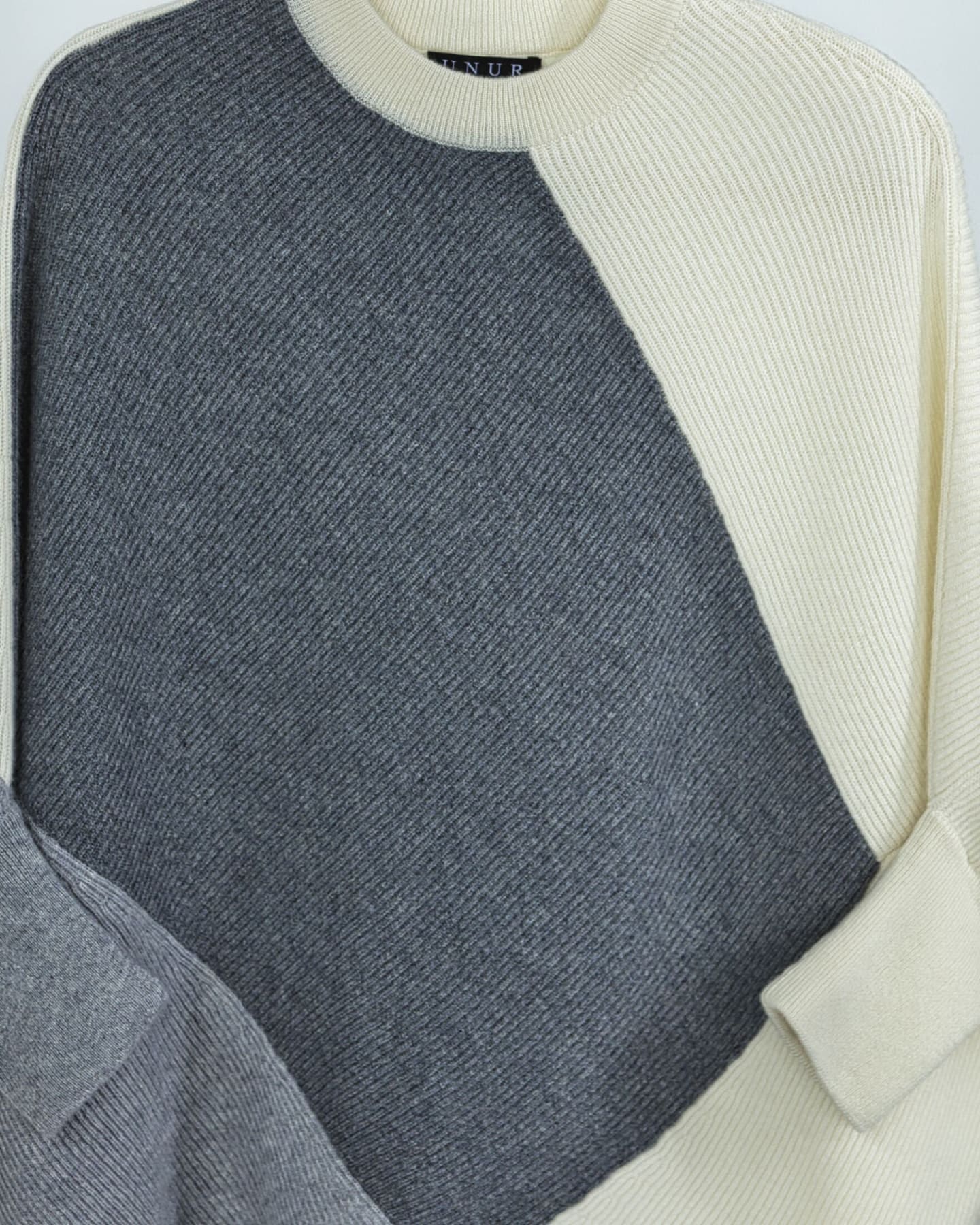 Close-up of two-tone vertical rib texture and counter-rib trim on cashmere jumper, grey colourway – Unur