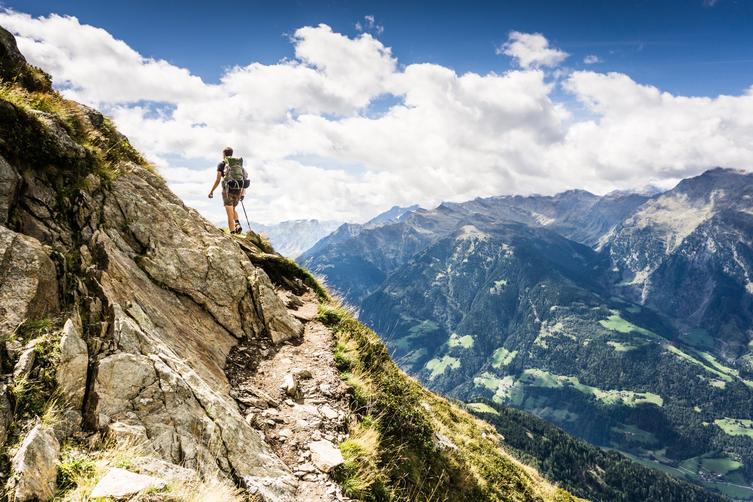 man_hiking_in_a_mountain