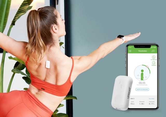 Woman stretching with Upright Go on her upper back