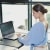 Woman working at her laptop with Upright device on her back