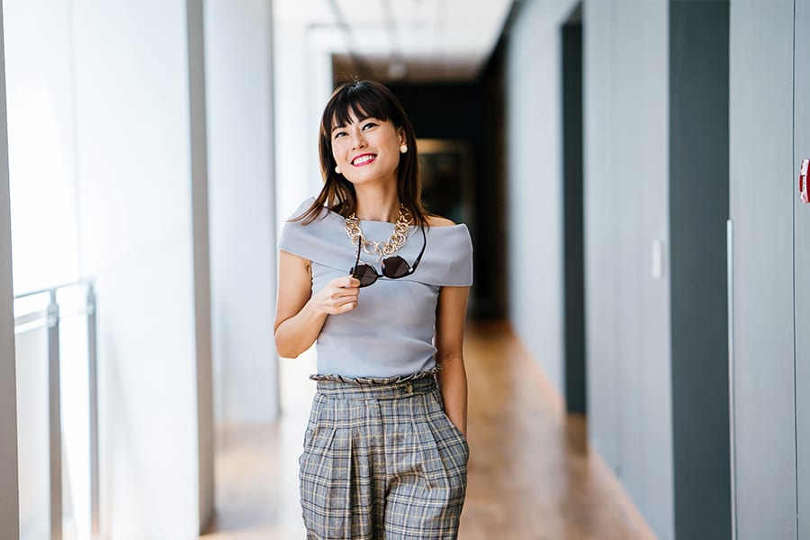 smiling woman walking upright