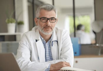 Doctor studying how to build good posture habits