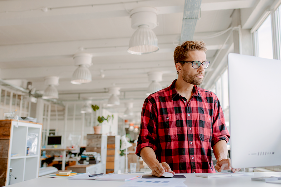 Man working at a standing desk