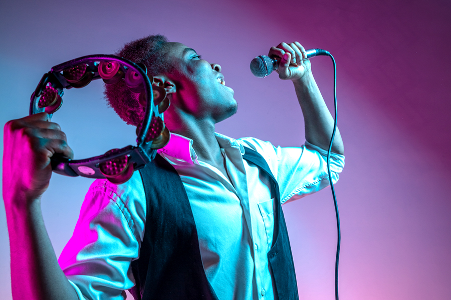 Male singer with elevated chest demonstrating good singing posture.
