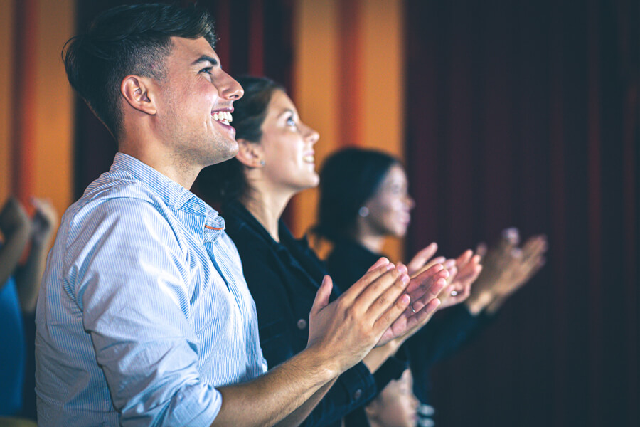 Audience giving a standing ovation.