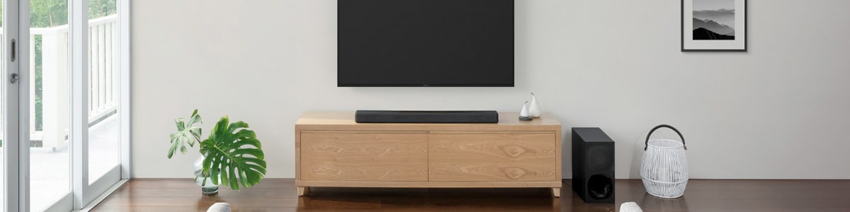 Wall-mounted speakers surround the big-screen TV with sound